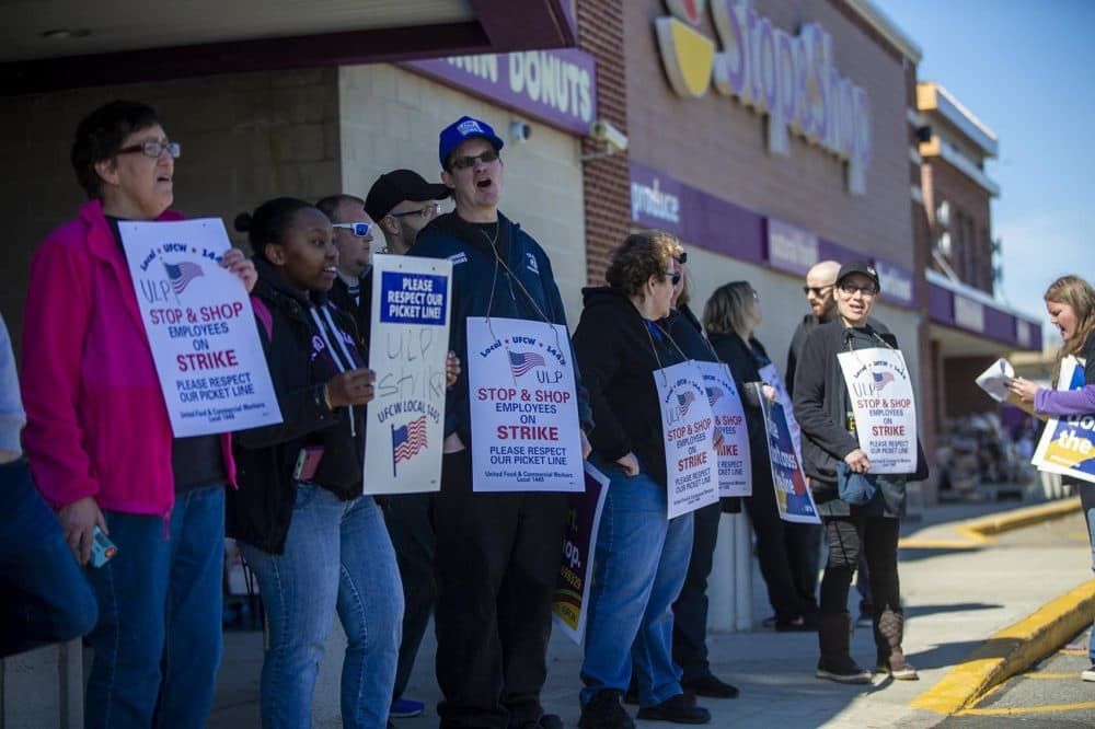 Stop & Shop workers strike outside the main entrance of the Somerville location on McGrath Highway. (Jesse Costa/WBUR)