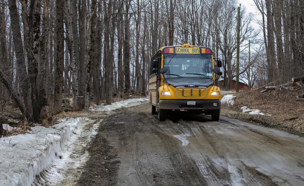 Joanne Deady's school bus navigates carefully over a icy and mud-covered Christian Hill Road in Colrain. (Jesse Costa/WBUR)