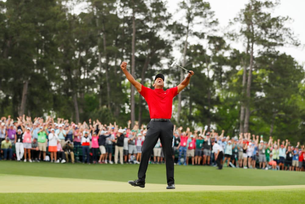 Tiger Woods celebrates after making his putt on the 18th green to win the Masters at Augusta National Golf Club on April 14, 2019, in Augusta, Ga. (Kevin C. Cox/Getty Images)