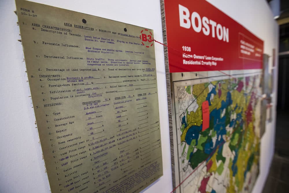 Documents and a map show examples of redlining in Boston in the &quot;Undesign the Redline: the Transformation of Race, Place, and Class in America&quot; exhibit at the Boston Architectural College. (Jesse Costa/WBUR)