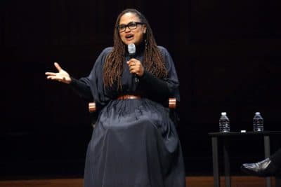 Acclaimed film director Ava DuVernay, who is also a producer and film distributor, speaks during the Friday evening program of Vision and Justice at the Sanders Theatre. (Hadley Green for WBUR)