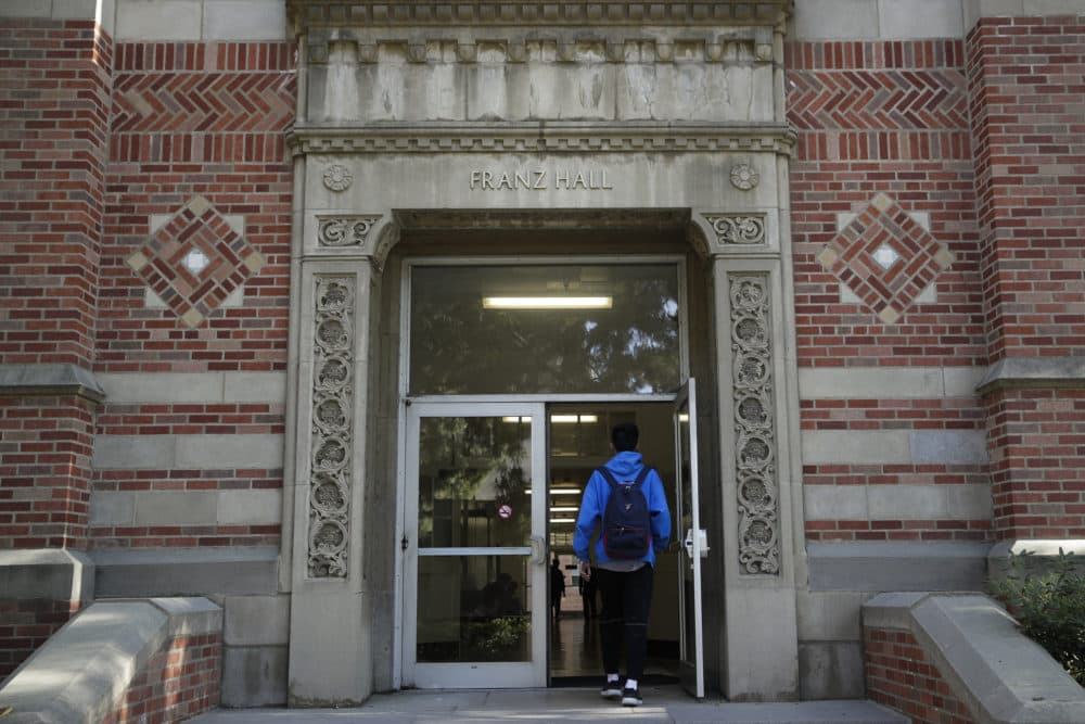 A student enters Franz Hall at University of California, Los Angeles, on April 25, 2019, in Los Angeles. Hundreds of students and staff at two Los Angeles universities, including UCLA, have been placed under quarantine because they may have been exposed to measles and either have not been vaccinated or cannot verify that they are immune. (Jae C. Hong/AP)