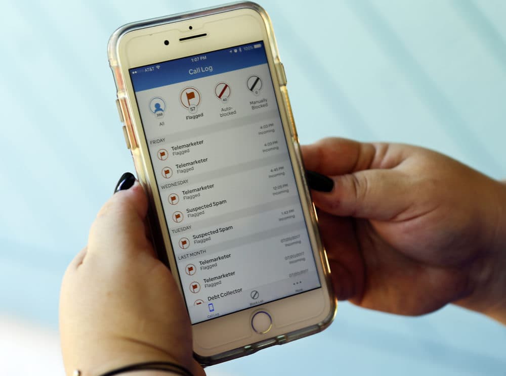 A call log displayed via an AT&T app on a cellphone in Orlando, Fla. helps locate and block fraudulent calls, although some robocalls do get through. (John Raoux/AP)