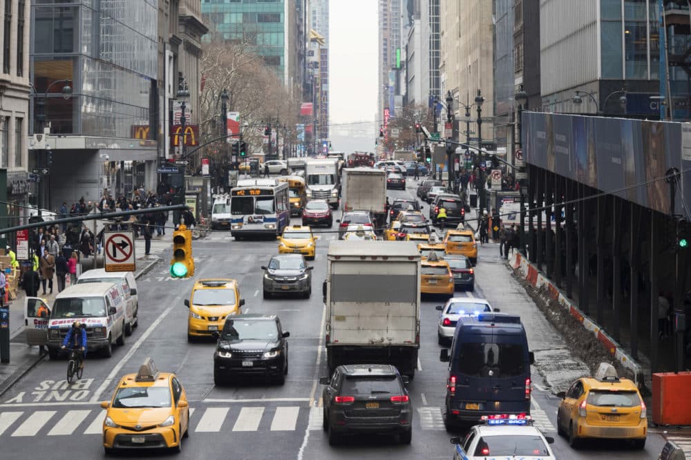 FILE- In this Jan. 11, 2018 file photo, traffic makes it's way across 42nd Street in New York City. (Mary Altaffer, File/AP)