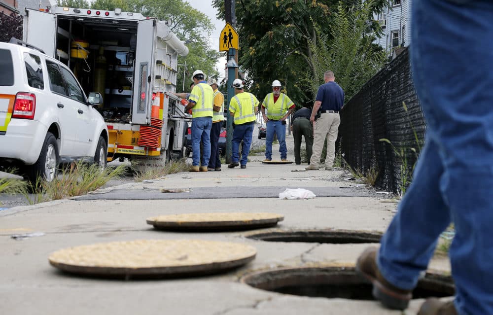 In this Sept. 14, 2018, file photo, a Columbia Gas crew works to make sure there are no gas leaks at the corner of Parker and Salem streets in Lawrence. (Mary Schwalm/AP)