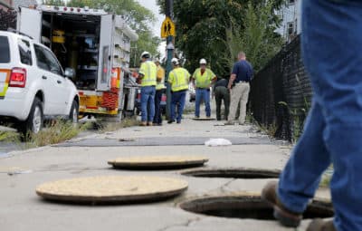 In this Sept. 14, 2018, file photo, a Columbia Gas crew works to make sure there are no gas leaks at the corner of Parker and Salem streets in Lawrence. (Mary Schwalm/AP)