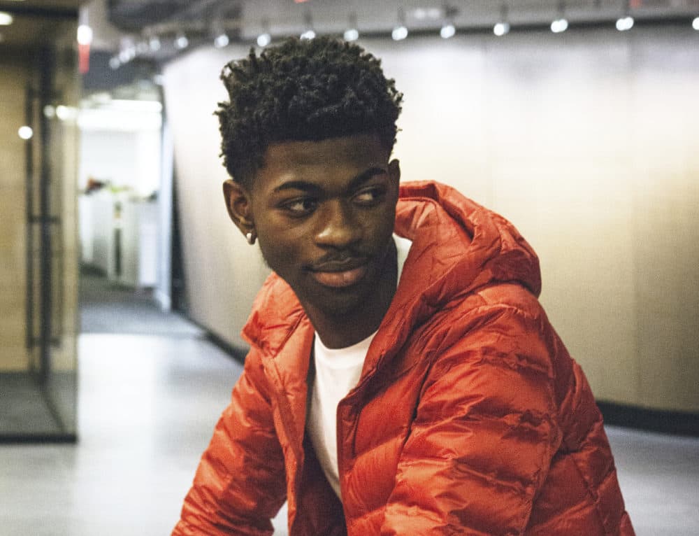 This undated image provided by Columbia Records shows rapper Lil Nas X, whose viral hit “Old Town Road” was removed from Billboard's country charts because they said it wasn’t country enough. (Eric Lagg/Courtesy of Columbia Records via AP)