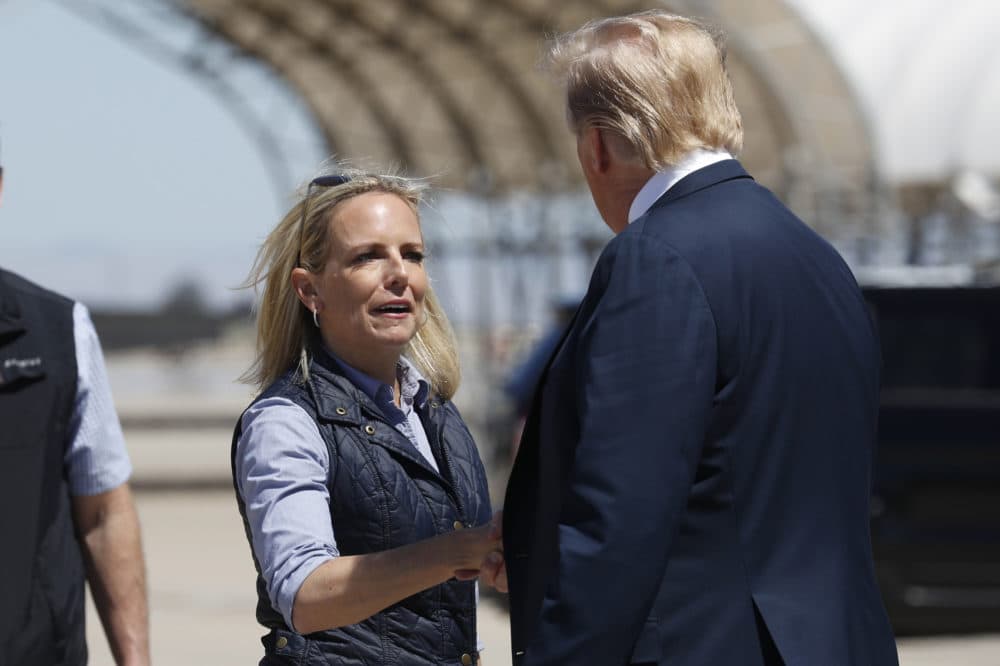 President Donald Trump greets Homeland Security Secretary Kirstjen Nielsen after he arrived on Air Force One at Naval Air Facility El Centro, in El Centro, Calif., Friday April 5, 2019. (Jacquelyn Martin/AP)