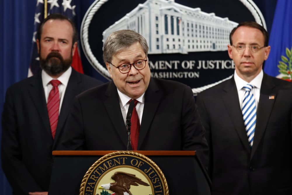 Attorney General William Barr speaks alongside Deputy Attorney General Rod Rosenstein, right, and acting Principal Associate Deputy Attorney General Edward O’Callaghan, left, about the redacted version of special counsel Robert Mueller's report on Thursday, April 18, 2019. (Patrick Semansky/AP)