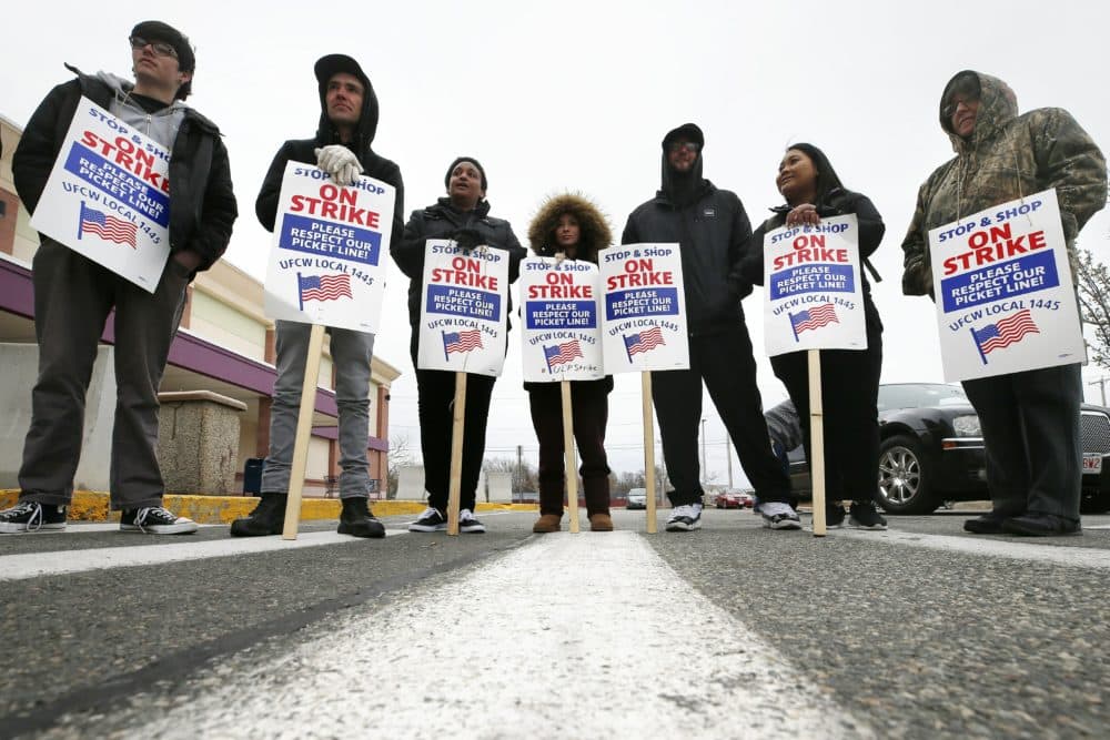 Striking workers stand on a picket line outside the Stop & Shop supermarket in Revere, Mass., Thursday, April 18, 2019. Thousands of workers remain on strike and rabbis in New England are advising their congregations not to cross the picket lines. (Michael Dwyer/AP)