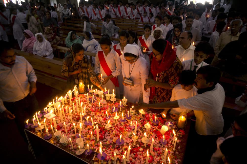 Pakistani Christians light candles during a vigil and special prayer service for the victims of the bomb explosions in churches and hotels in Sri Lanka, in Islamabad, Pakistan on Thursday. (B.K. Bangash/AP)