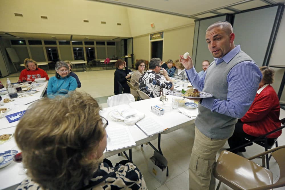 In this March 21, 2013 photograph, Rabbi Marshal Klaven leads a Seder, the traditional Passover meal, with members of St. Philip's Episcopal Church in Jackson, Miss. (Rogelio V. Solis/AP)
