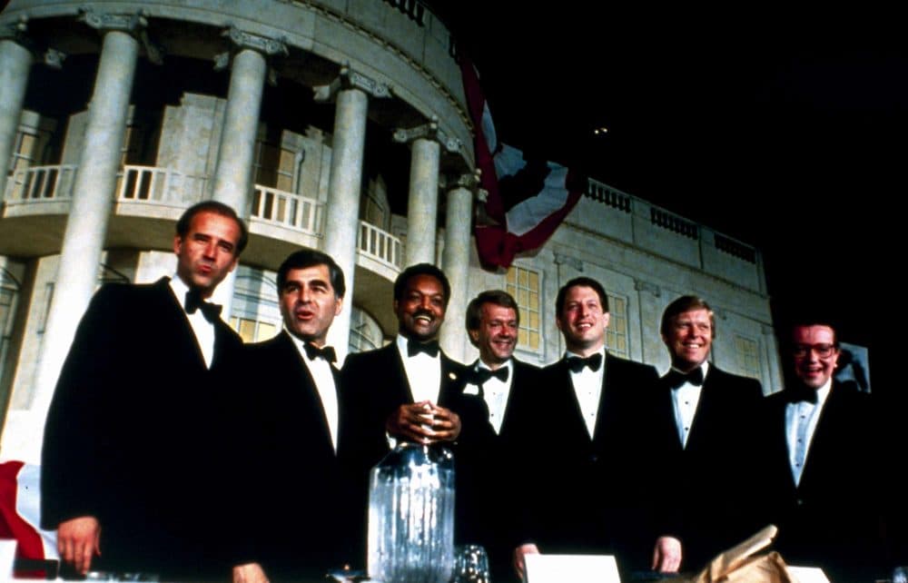 Democratic presidential candidates pose in front of a replica of the White House during an Independent Action Roast in Washington on June 23, 1987. Then-Sen. Joe Biden and Massachusetts Gov. Michael Dukakis are at left. (Charles Tasnadi/AP)