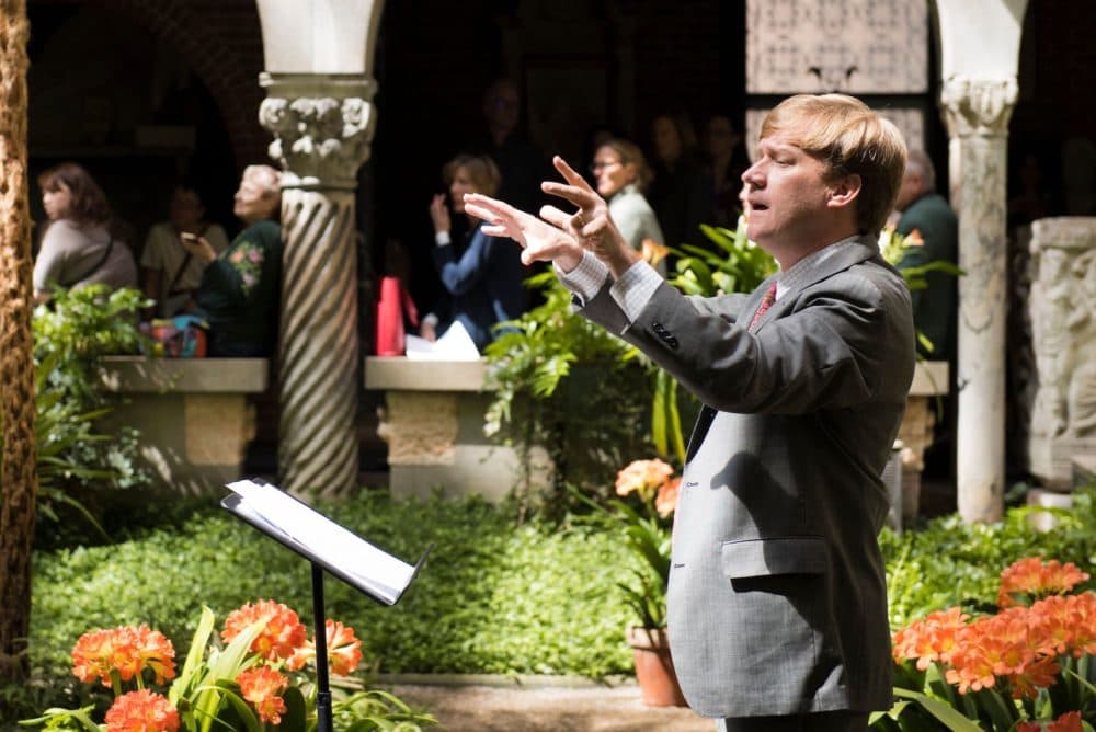 George Steel conducting in the Isabella Stewart Gardner Museum courtyard. (Courtesy Liza Voll)