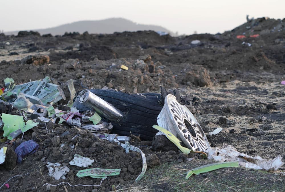 Parts of an engine and the landing gear lay in a pile after being gathered by workers during the continuing recovery efforts at the crash site of Ethiopian Airlines flight ET302 on March 11, 2019 in Bishoftu, Ethiopia.(Photo by Jemal Countess/Getty Images)