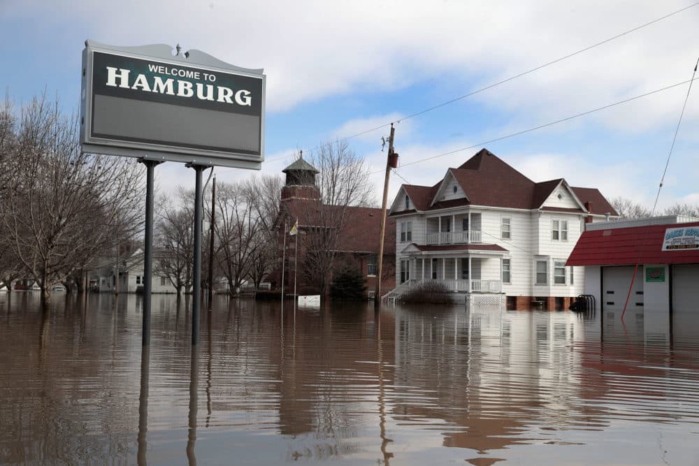 A home sits in flood water on March 20, 2019 in Hamburg, Iowa. Although flood water in the town has started to recede many homes and businesses remain surrounded by water. (Scott Olson/Getty Images)