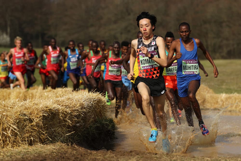 Yohei Komatsu of Japan and Felicien Muhitira of Rwanda compete in the Senior Men's final during the IAAF World Athletics Cross Country Championships on March 30, 2019 in Aarhus, Denmark. (Bryn Lennon/Getty Images)