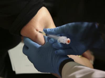 A woman receives a measles, mumps and rubella vaccine at the Rockland County Health Department in Pomona, N.Y. on March 27. (Seth Wenig/AP)