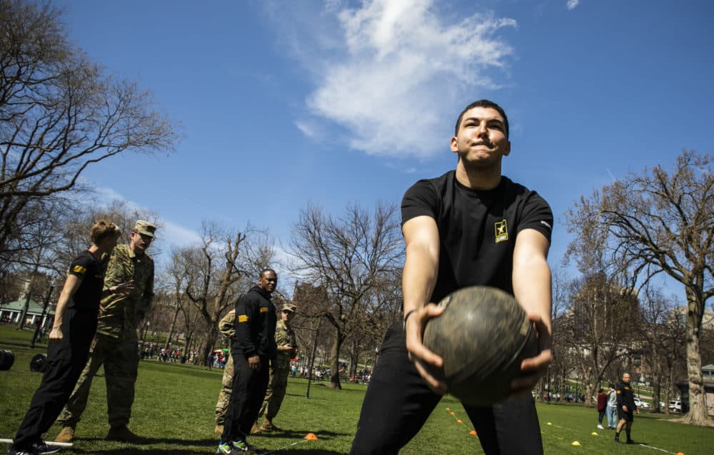 Paulo Deoliveira throws a 10-pound ball during a practice fitness training at the first-ever Army Week hosted by the U.S. Army at Boston Common, on April 13. (Erin Clark for WBUR)
