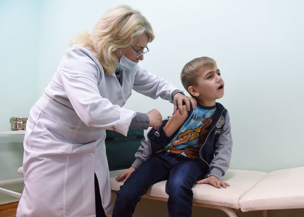 A nurse administers a measles vaccine to a boy in the Lapaivka village near the western Ukrainian city of Lviv on Feb. 21, 2019. (Yuri Dyachyshyn/AFP/Getty Images)