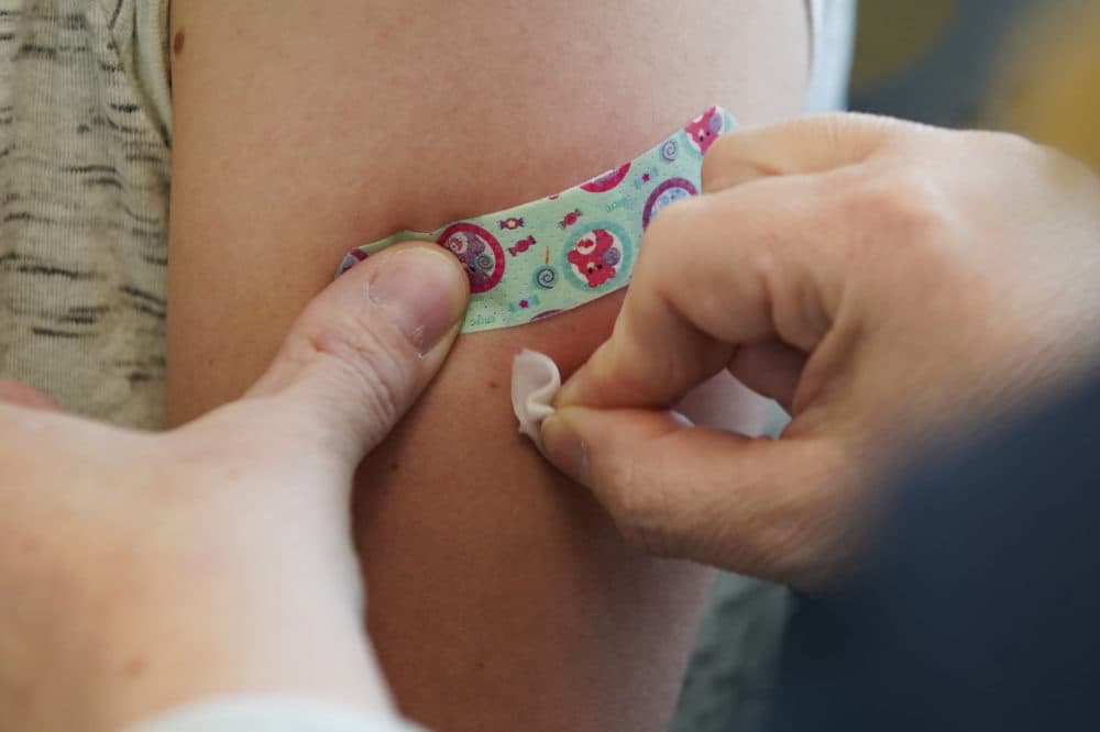 A nurse prepares a patient's arm to receive a measles, mumps and rubella virus vaccine on April 29, 2019, in Provo, Utah. (George Frey/Getty Images)