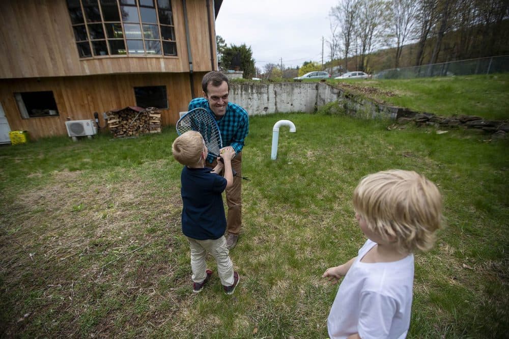 At his Holyoke home, Guy O’Donnell plays with the two boys who've been living with him for the past two years. He's been trying to adopt them for more than two years. (Jesse Costa/WBUR)