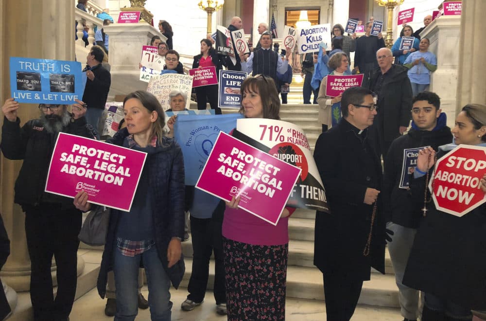 People both supporting and opposing abortion protest at the Statehouse March 5 in Providence, R.I. (Jennifer McDermott/AP)