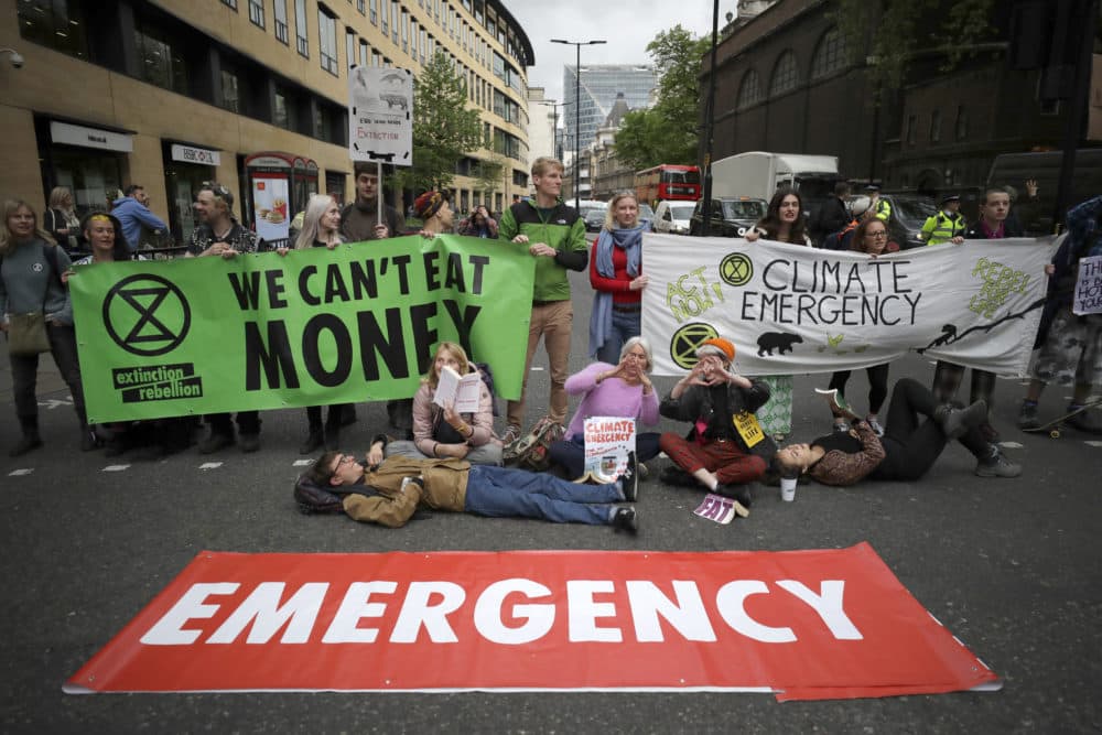 Extinction Rebellion climate change protesters briefly block the road in the City of London, Thursday, April 25, 2019. (Matt Dunham/AP)