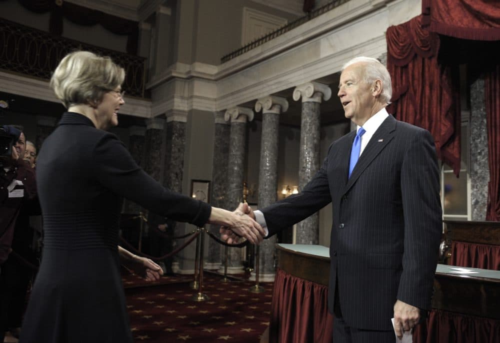Joe Biden, then the vice president, welcomed Sen. Elizabeth Warren at her swearing-in ceremony in 2013. Seven years later, Biden could welcome Warren to his presidential campaign as a running mate. (Cliff Owen/AP)