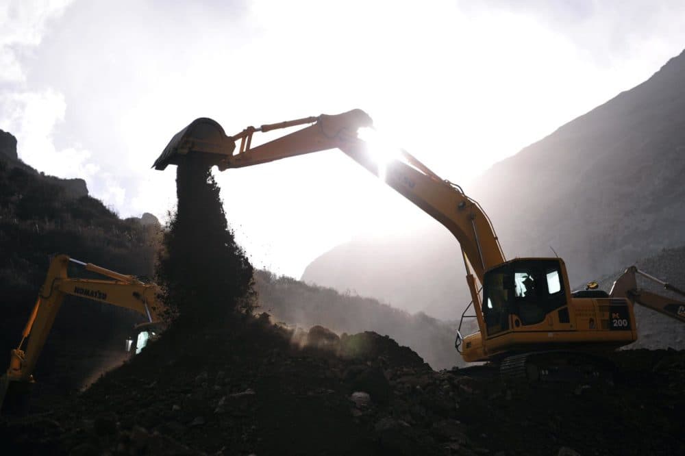 In this photo released by China's Xinhua News Agency, an excavator works at the accident site in Maizhokunggar County of Lhasa, southwest China's Tibet Autonomous Region, Sunday, March 31, 2013. (Xinhua, Liu Kun/AP)