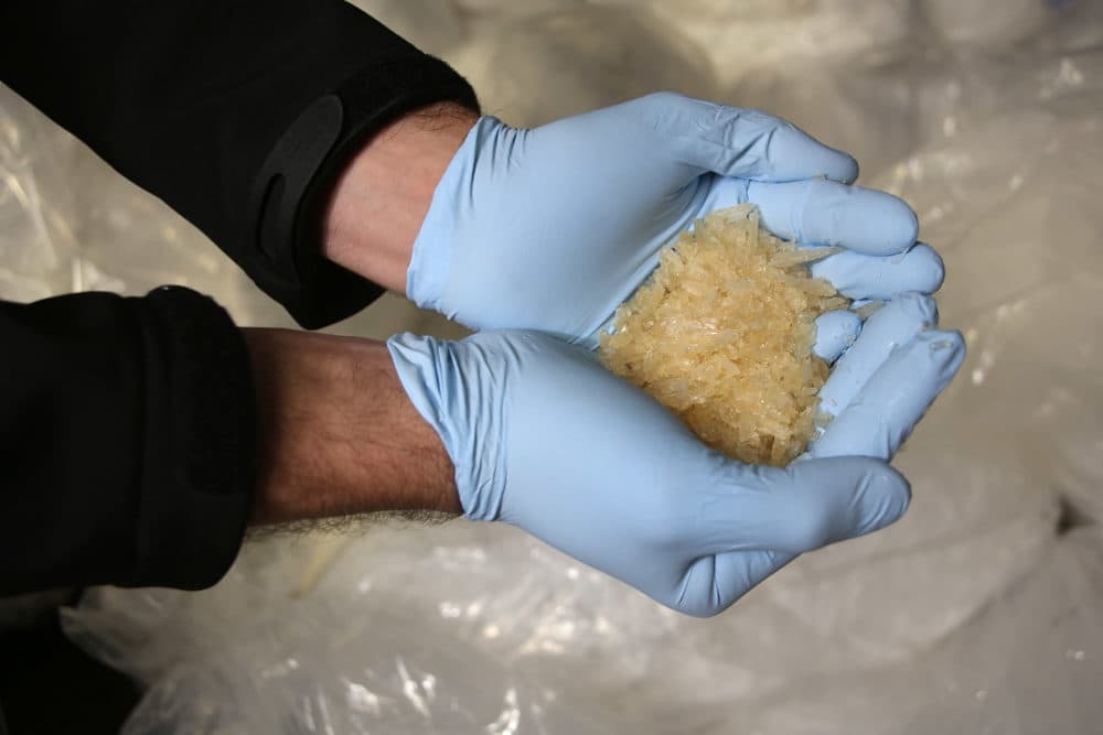 Members of the Bundeskriminalamt German law enforcement agency (BKA), the Federal Criminal Office, display portions of 2.9 tonnes of recently-confiscated chlorephedrin, one of the main ingredients used to manufacture methamphetamine, also called crystal meth, at a press conference on November 13, 2014 in Wiesbaden, Germany.  (Photo by Hannelore Foerster/Getty Images)