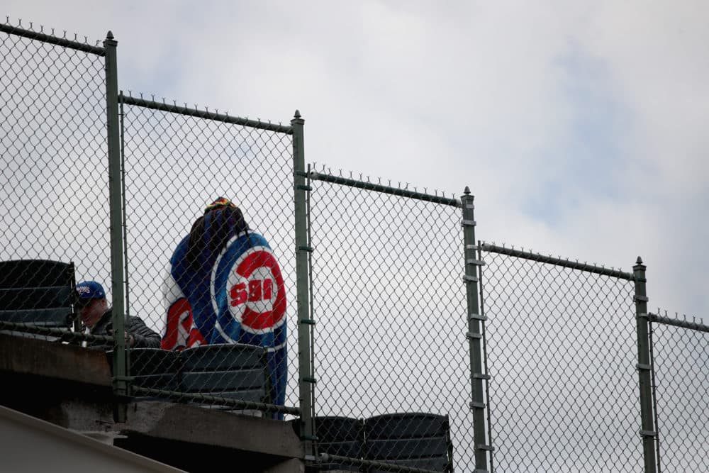 A fan at Wrigley Field waits for the start of the Chicago Cubs home opener on April 10, 2018 in Chicago. (Scott Olson/Getty Images)