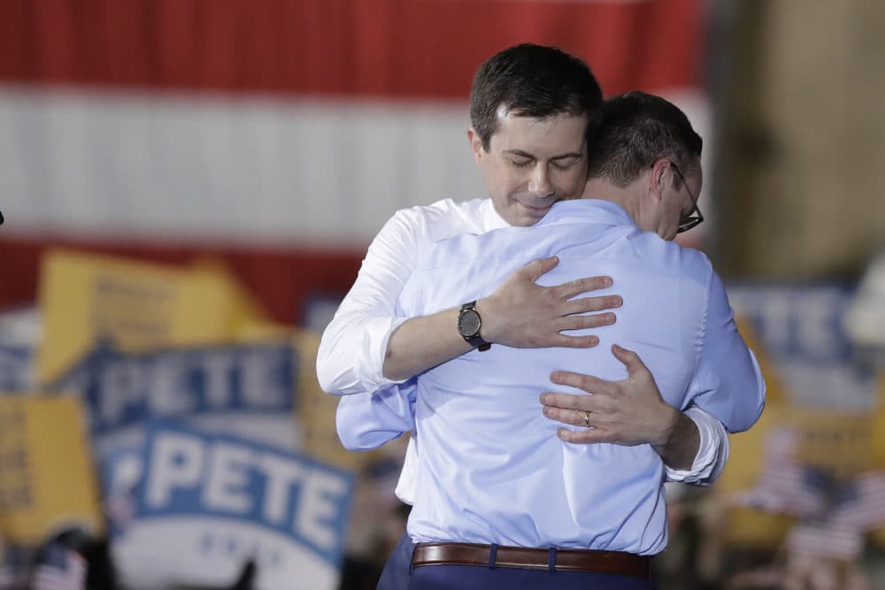 South Bend Mayor Pete Buttigieg, left, hugs his husband, Chasten Glezman, after Buttigieg announces that he will seek the Democratic presidential nomination during a rally, April 14, 2019, in South Bend, Ind. (Darron Cummings/AP)
