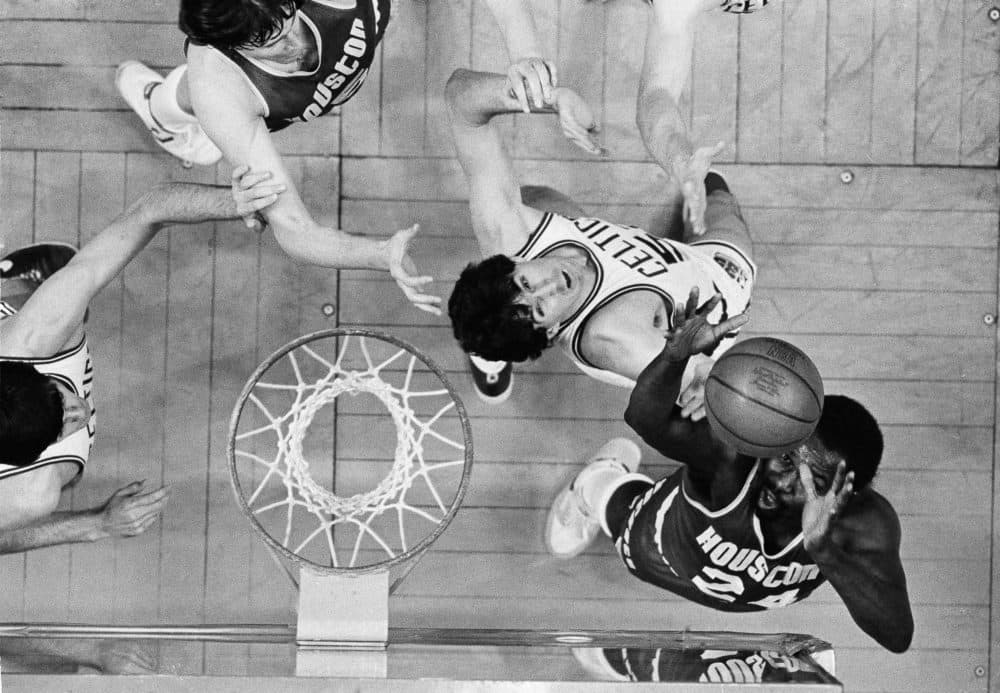 Houston Rockets center Moses Malone (24) goes after a rebound against Boston Celtics center Rick Robey during Game 2 of the 1981 NBA Finals. (Dave Tenenbaum/AP)