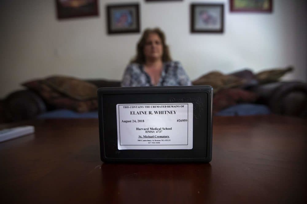 A cremation box with the ashes of Elaine Whitney sits on a table in the home of her daughter, Diana Mamouni. (Jesse Costa/WBUR)