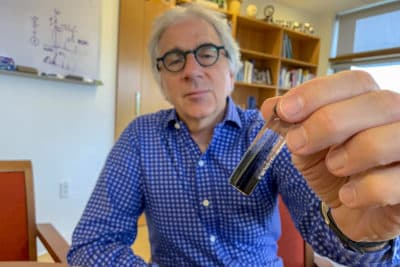 Harvard researcher Doug Melton holds a vial of insulin-producing cells made in his lab. (Karen Weintraub)