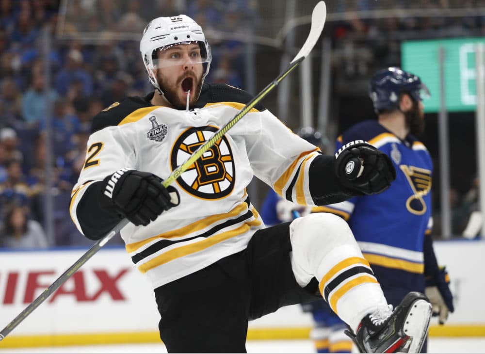Boston Bruins center Sean Kuraly (52) celebrates after scoring a goal against the St. Louis Blues during the first period of Game 3 of the NHL hockey Stanley Cup Final Saturday, June 1, 2019, in St. Louis. (Jeff Roberson/AP)