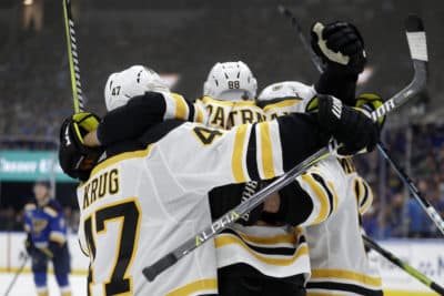 Boston Bruins right wing David Pastrnak (88), of the Czech Republic, celebrates after scoring against the St. Louis Blues during the third period of Game 6 of the NHL hockey Stanley Cup Final Sunday in St. Louis. (Jeff Roberson/AP)