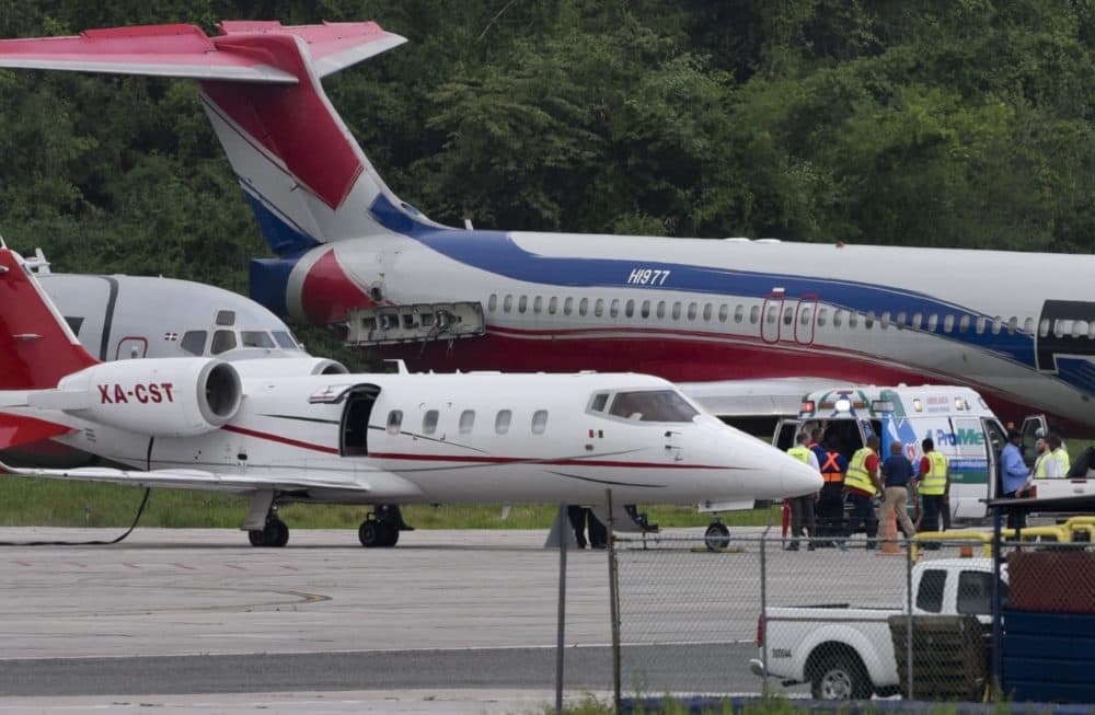 The ambulance carrying David Ortiz is parked next to a small ambulance plane that would fly him to Boston, at Las Americas Airport in Santo Domingo, Dominican Republic. (Juan Miguel Pena/AP)