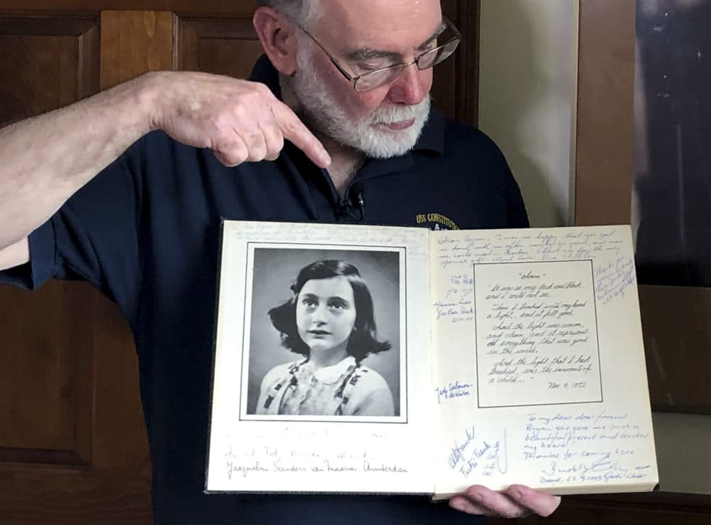 Ryan Cooper holds a 1972 portion of a diary that he wrote when he visited Otto Frank, the father of the famed Holocaust victim and diarist Anne Frank, at his home in Yarmouth, Mass. Cooper has donated a trove of letters and mementos to the U.S. Holocaust Memorial Museum (Philip Marcelo/AP)