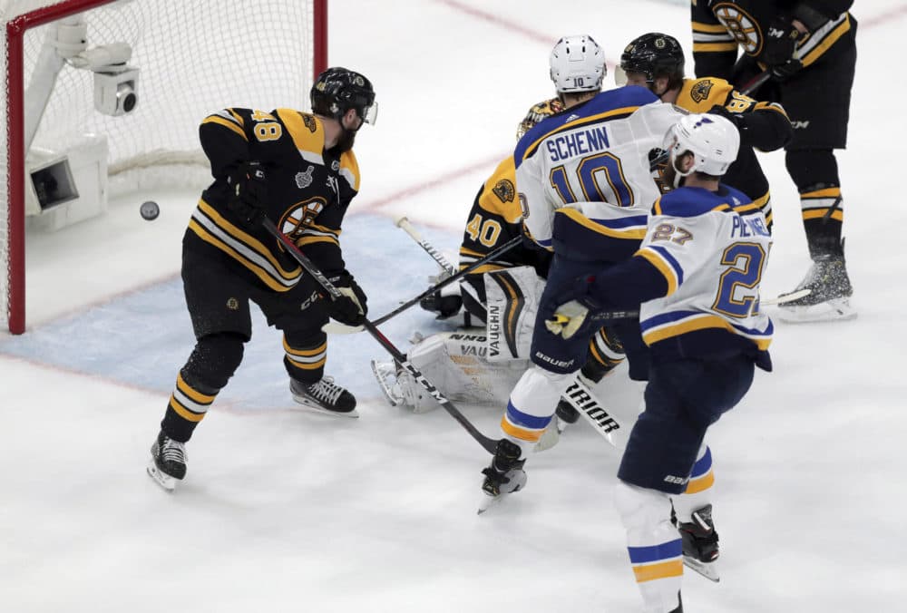 St. Louis Blues' Alex Pietrangelo, right, watches his shot sail into the net behind Boston Bruins goaltender Tuukka Rask during the first period in Game 7 Wednesday in Boston. (Charles Krupa/AP)