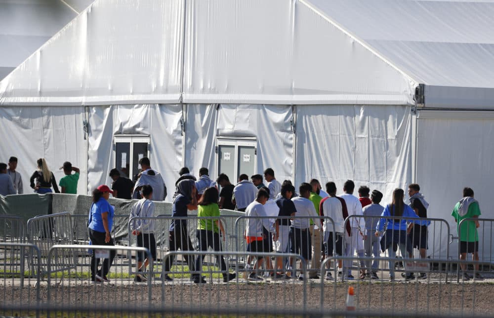 In this Feb. 19, 2019 file photo, children line up to enter a tent at the Homestead Temporary Shelter for Unaccompanied Children in Homestead, Fla. (Wilfredo Lee/AP)