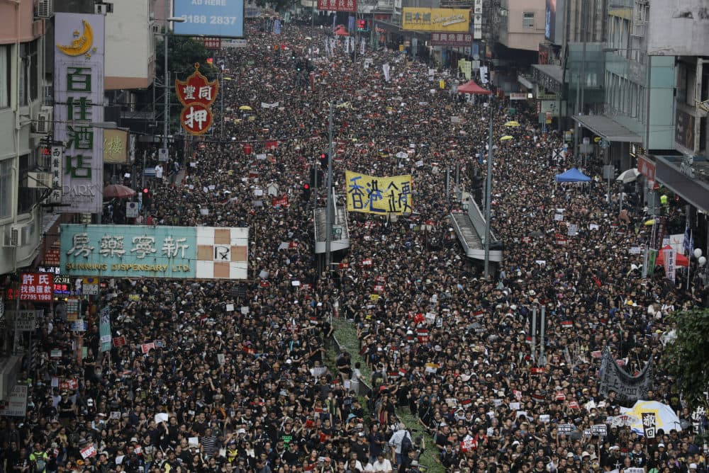 Protesters march through the streets in Hong Kong as they continue to protest an extradition bill, Sunday, June 16. (Vincent Yu/AP)