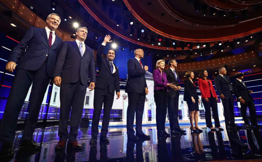 Democratic presidential candidates pose for a photo before the start of the first Democratic primary debate hosted by NBC News on Wednesday, June 26, 2019, in Miami. (Brynn Anderson/AP)