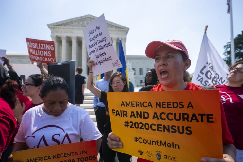 Demonstrators gather at the Supreme Court as the justices Thursday. (J. Scott Applewhite/AP)