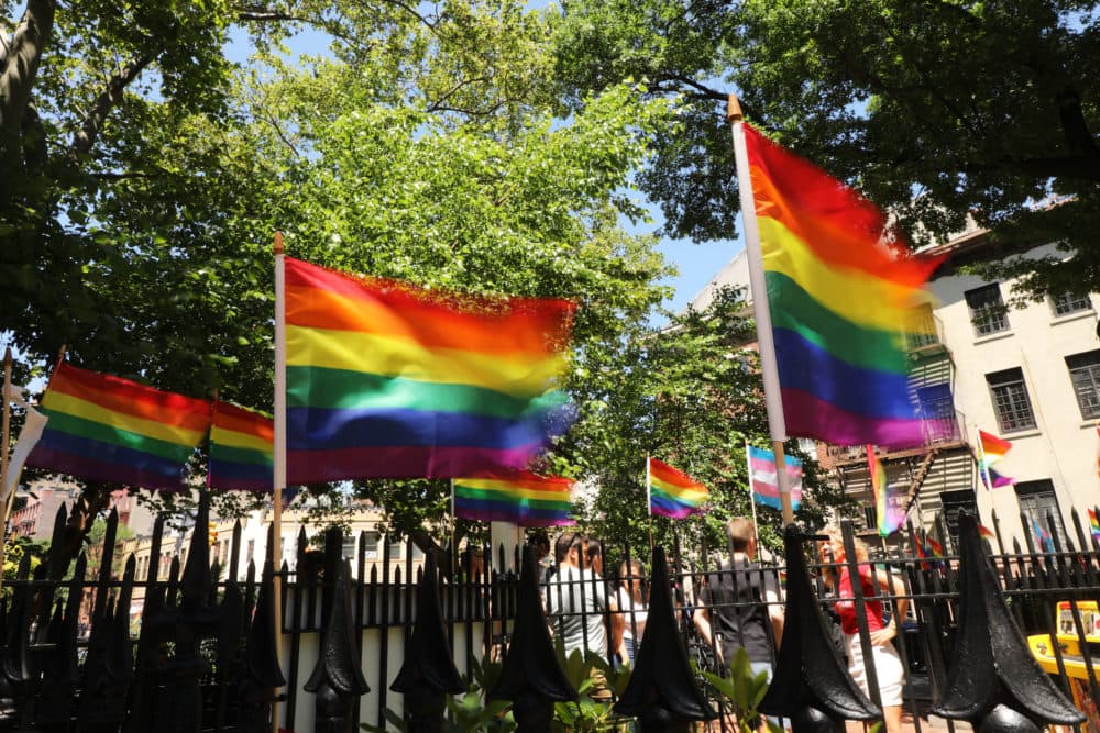 Rainbow pride flags fly outside the Stonewall Inn as crowds begin to gather to celebrate Pride Month in New York City. (Spencer Platt/Getty Images)