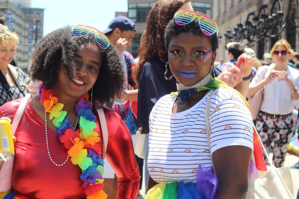 Britany Wade, left, with sister Brianna Strange celebrate at Boston's 49th Pride Parade celebration at Copley Square. (Quincy Walters/WBUR)