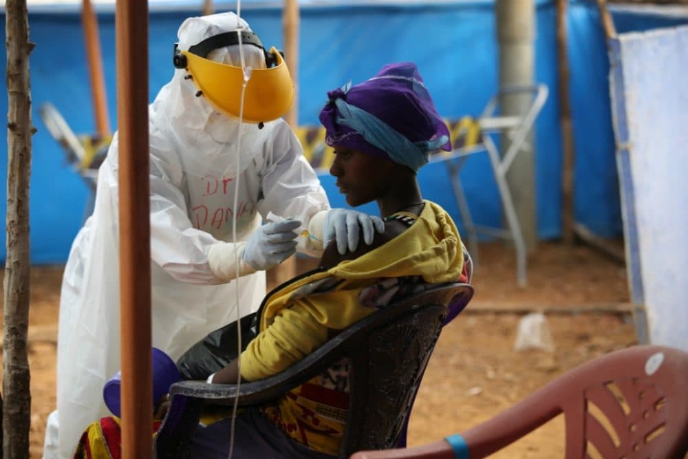 Partners In Health recruit Dr. Dana Clutter tends to a patient in the triage area of the Maforki Ebola treatment unit in Sierra Leone on Jan. 15, 2015. (Photo by Rebecca E. Rollins/Partners In Health)
