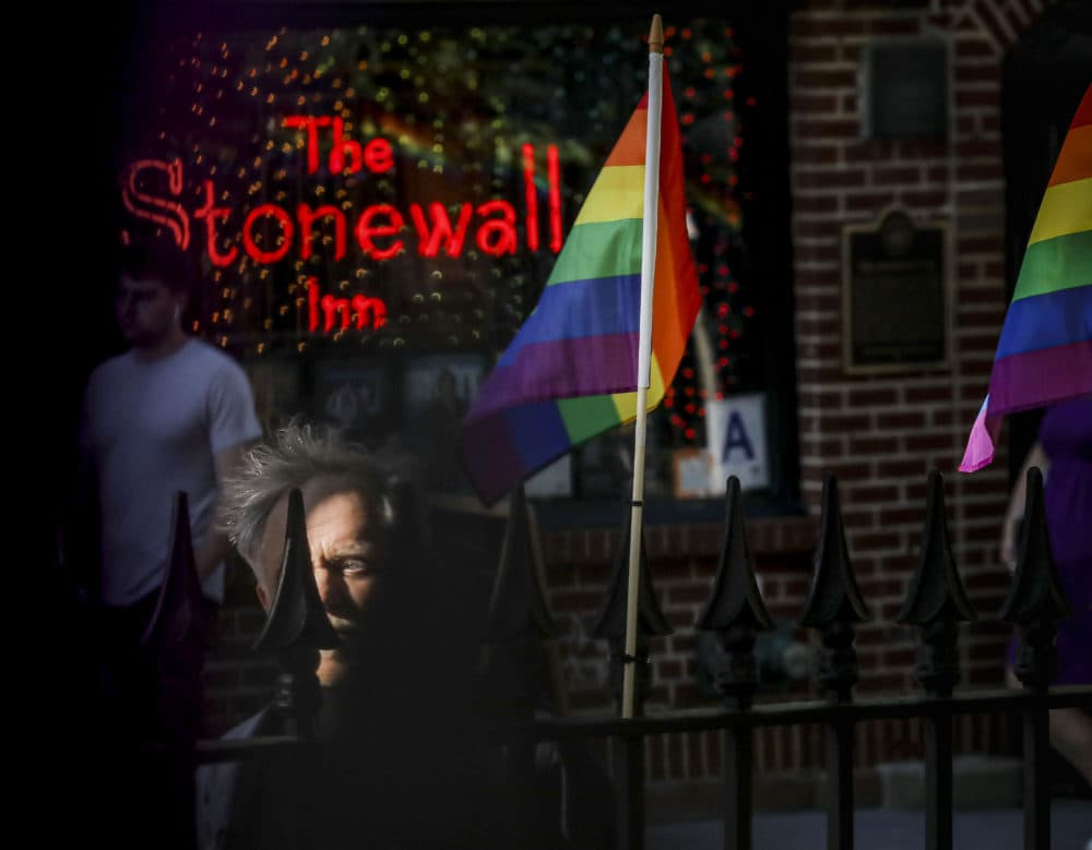 In this Monday, June 3, 2019, photo, gay rights activist Jim Fouratt stands across the street from The Stonewall Inn bar in New York. Fouratt witnessed an arrest at the bar on the night of June 27, 1969, that foreshadowed a series of violent confrontations between the New York Police Department and the bar's gay patrons, sparking a movement for gay rights. (Bebeto Matthews/AP)