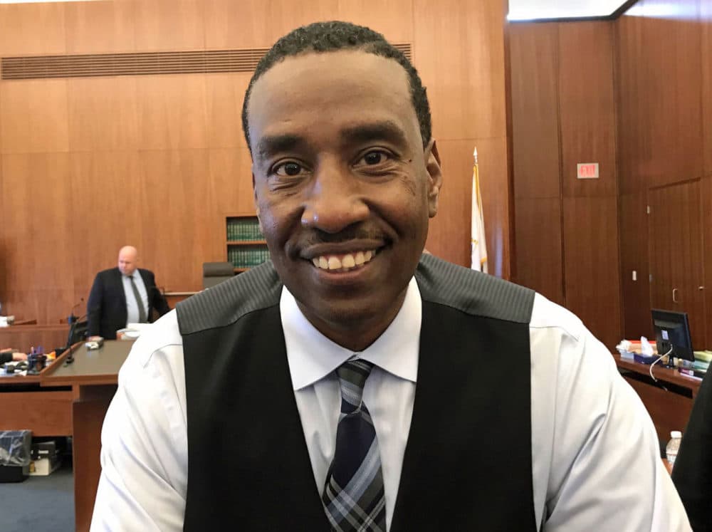 Darrell Jones smiles in the courtroom after he is found not guilty in the retrial of a murder case. (Bruce Gellerman/WBUR)
